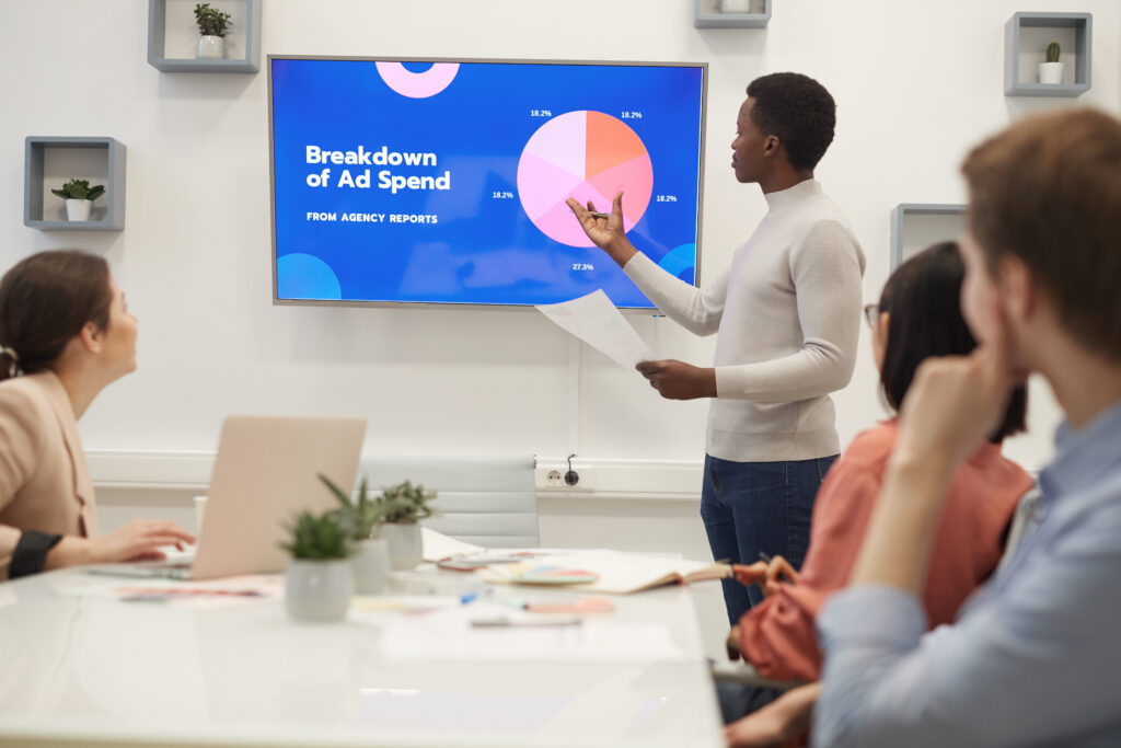 african businessman giving presentation on marketing